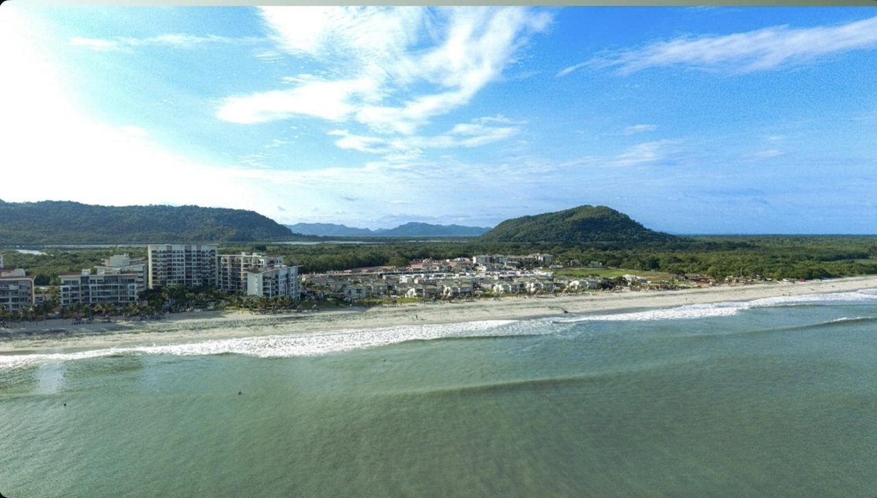 Aerial view of Playa Caracol beachfront residences on Panama's Pacific coast