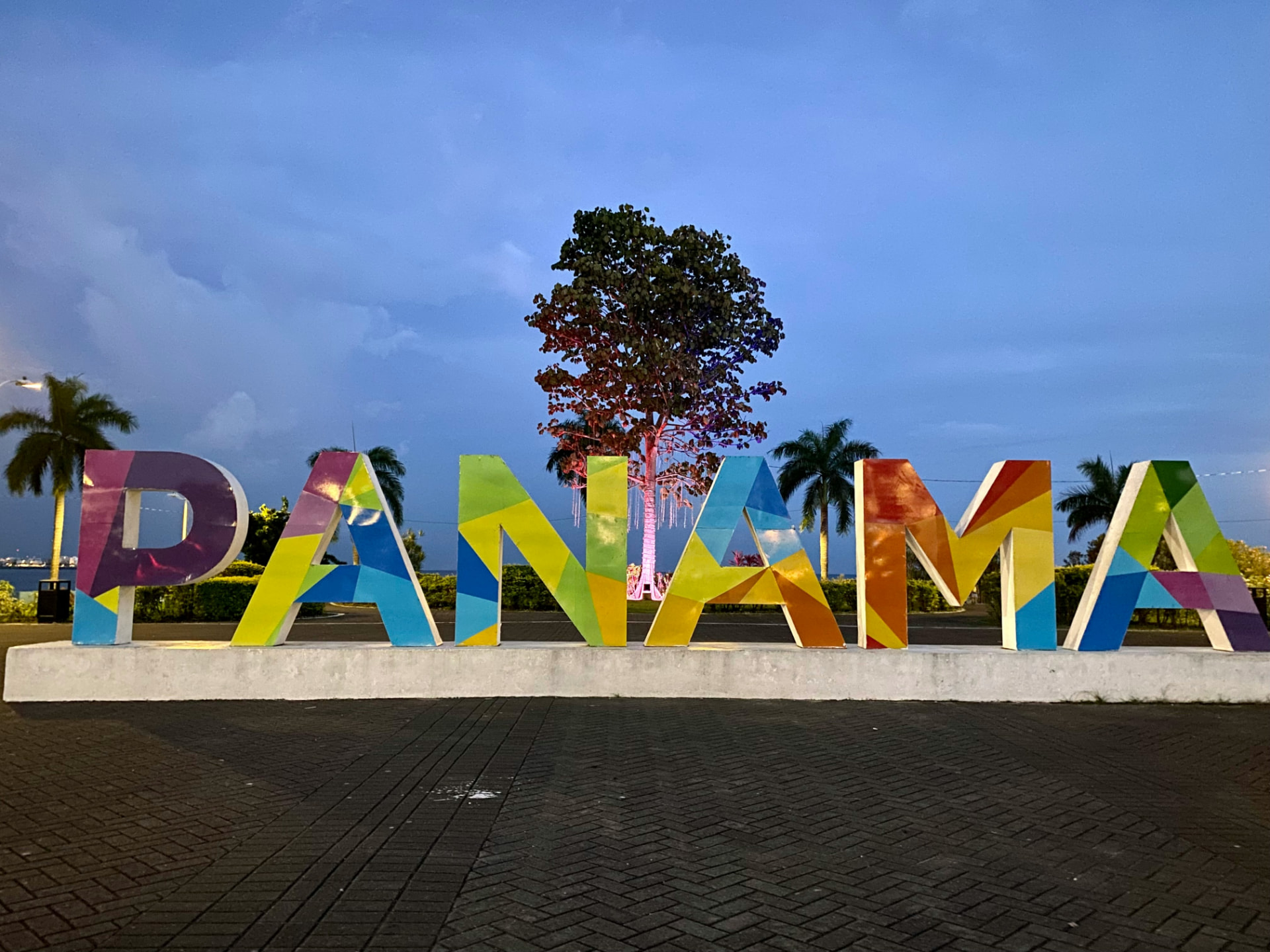 Colorful PANAMA letter sign on the Panama City waterfront at dusk